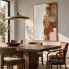 White and Muted Patchwork Abstract Painting shown above a dining table.
