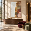 White and Muted Patchwork Abstract Painting shown above a wood cabinet between lounge chairs.