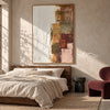 White and Muted Patchwork Abstract Painting shown above a bed with neutral bedding.