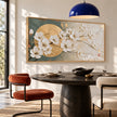 White Blossoms across a Golden Circle Wall Art shown above a dining table.