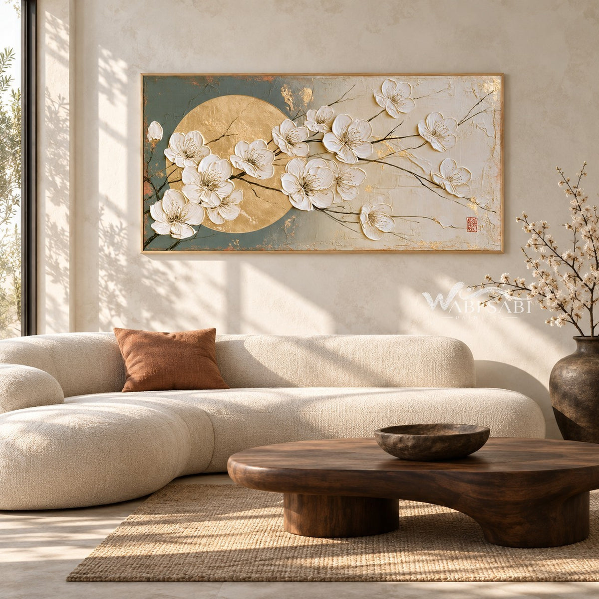 White Blossoms across a Golden Circle Wall Art shown above a pale sofa.