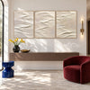 White Folded Ridges Triptych Wall Art shown above a console.