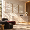 White Folded Ridges Triptych Wall Art shown in a seating area.