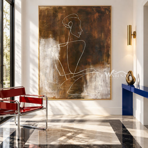 White Seated Figure Line Painting on Brown shown in an entryway.