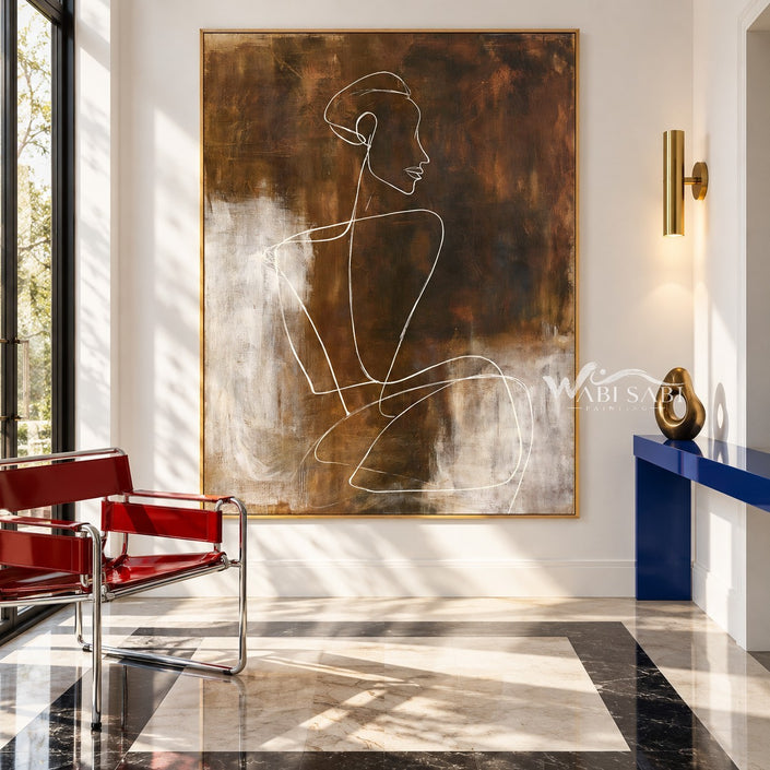 White Seated Figure Line Painting on Brown shown in an entryway.