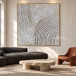 White Turning Grooves Square Wall Art shown in a living room with a sofa.