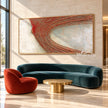 Wide Rust Curved Ridge Abstract Painting shown in a living room with a sofa.