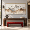 Wide White Mountain Range Wall Art shown above a console and red bench.
