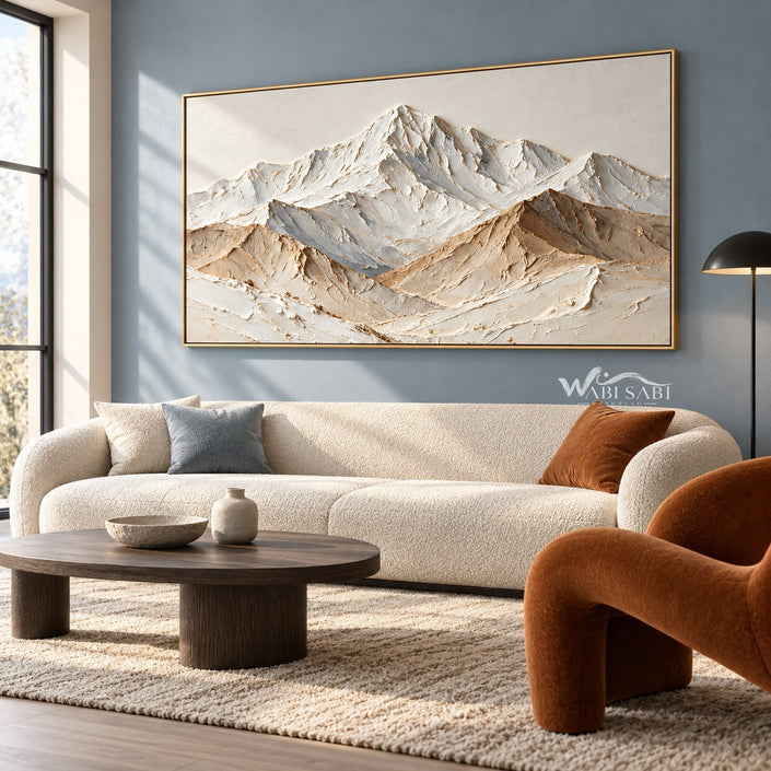 Wide White Mountain Range Wall Art shown above a cream sofa.