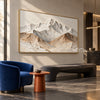 Wide White Mountain Range Wall Art shown above a dark bench beside a blue chair.